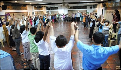 Dialogue Circle at UP - hands raised